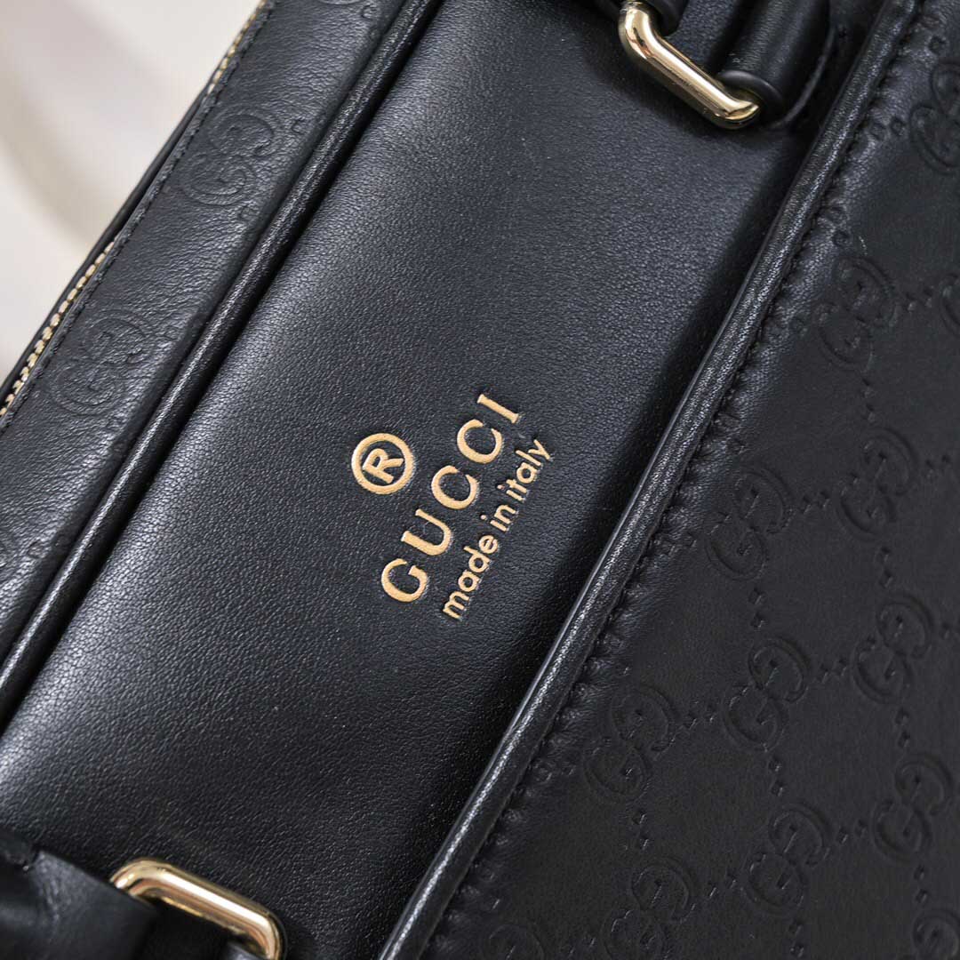 Túi xách Gucci nam siêu cấp màu đen họa tiết logo chữ vàng  